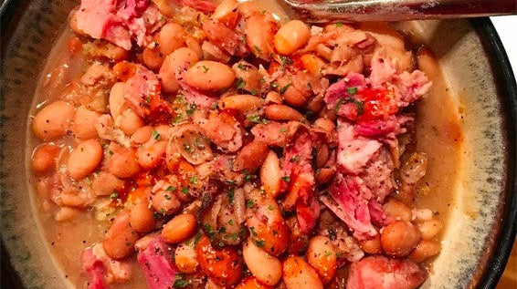 A bowl full of ham and bean soup