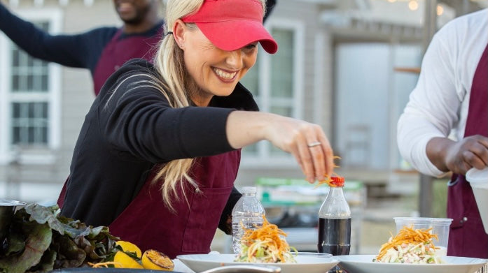 Pitmaster Megan Day finishes "colaslaw"