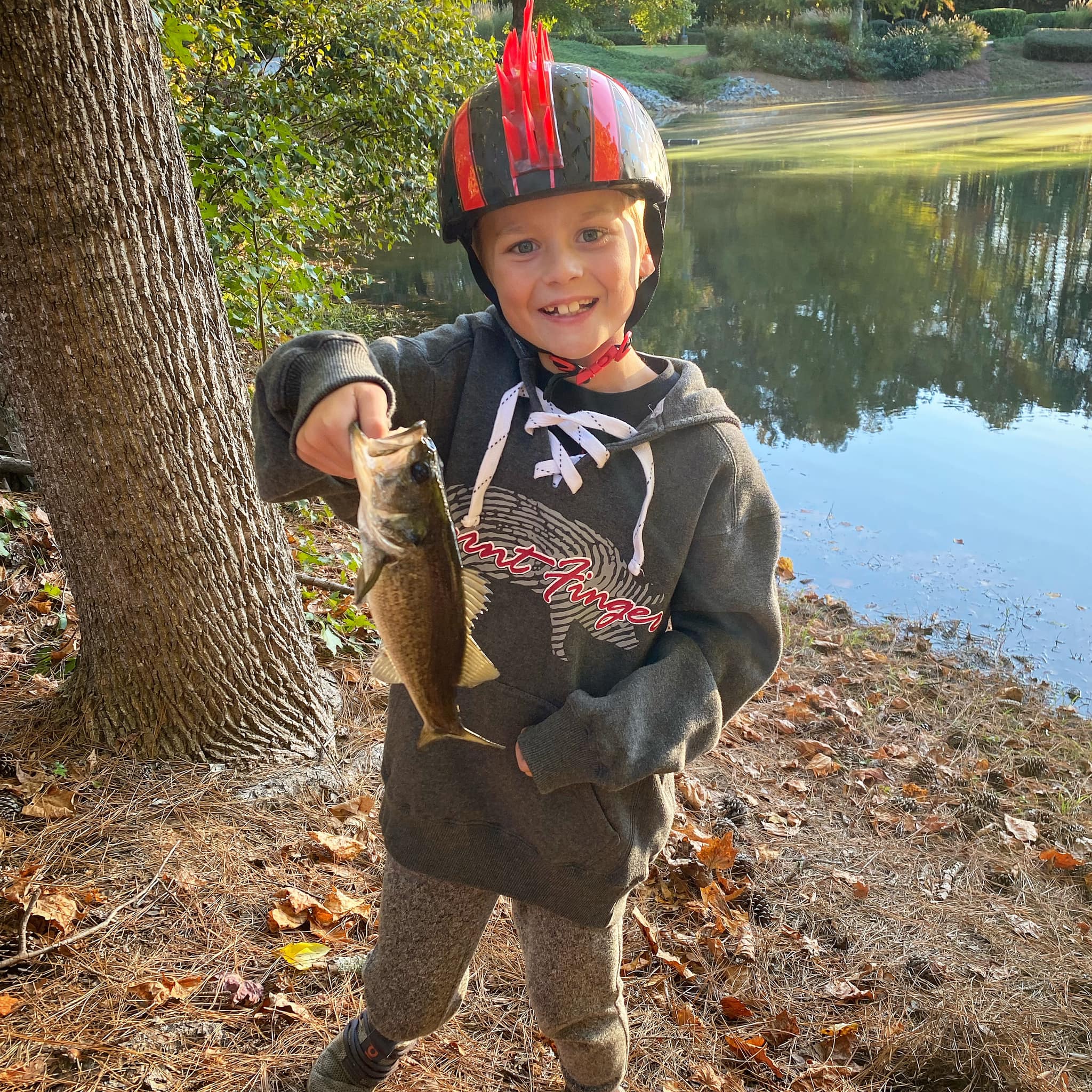Hank wearing the Burnt Finger Hockey Hoodie while fishing