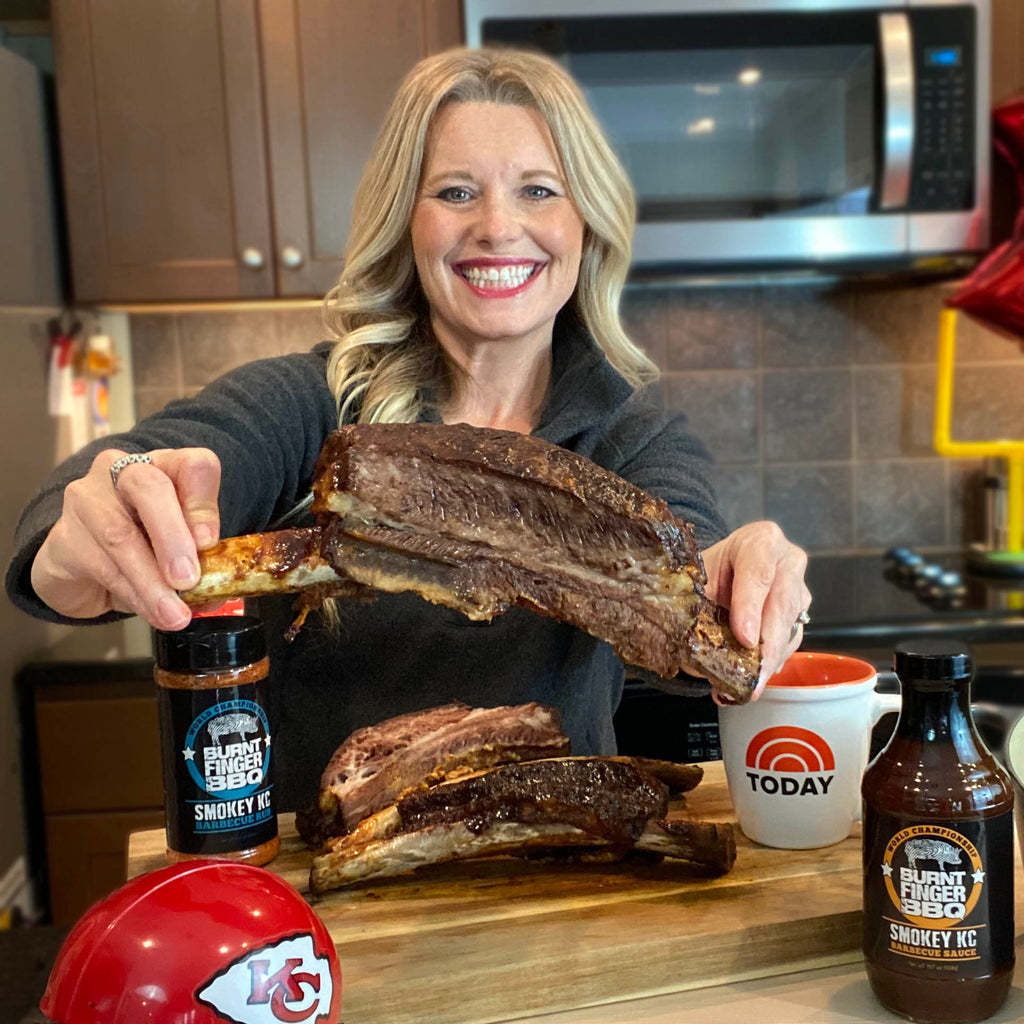 Pitmaster Megan Day holding a beef rib